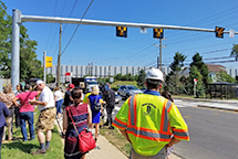 A photograph of a Pedestrian Hybrid Beacon (PHB) at a crossing in Fairfax County, VA.
